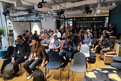 Participants at the first TYPO3 Camp UK in London sit in the MSQ event room in Covent Garden and wait for the next presentation.